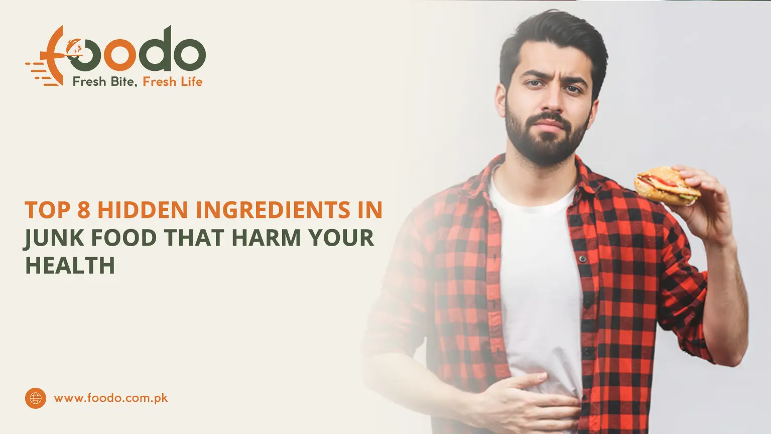 Bearded young man in red plaid shirt looking concerned at junk food burger, holding it up with hand on stomach, illustrating hidden harmful ingredients in fast food that damage health