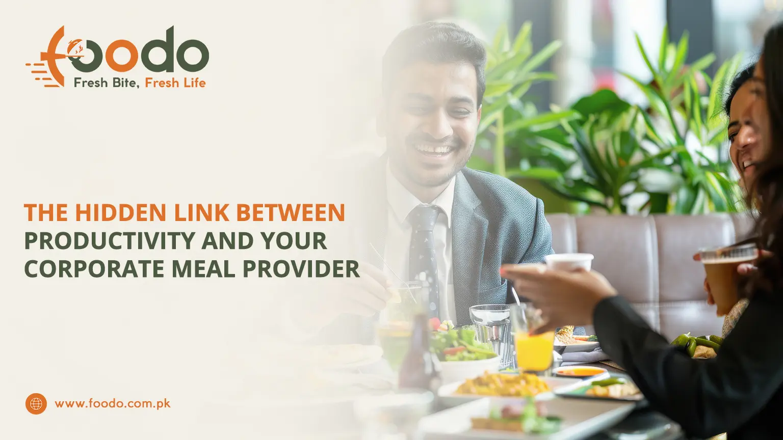 Smiling young professional man at corporate office lunch table with colleagues, enjoying healthy balanced meal, holding spoon, happy team eating nutritious food to boost productivity
